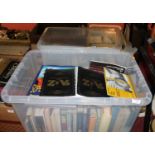 Two boxes containing a collection of various books, mainly toys and models related