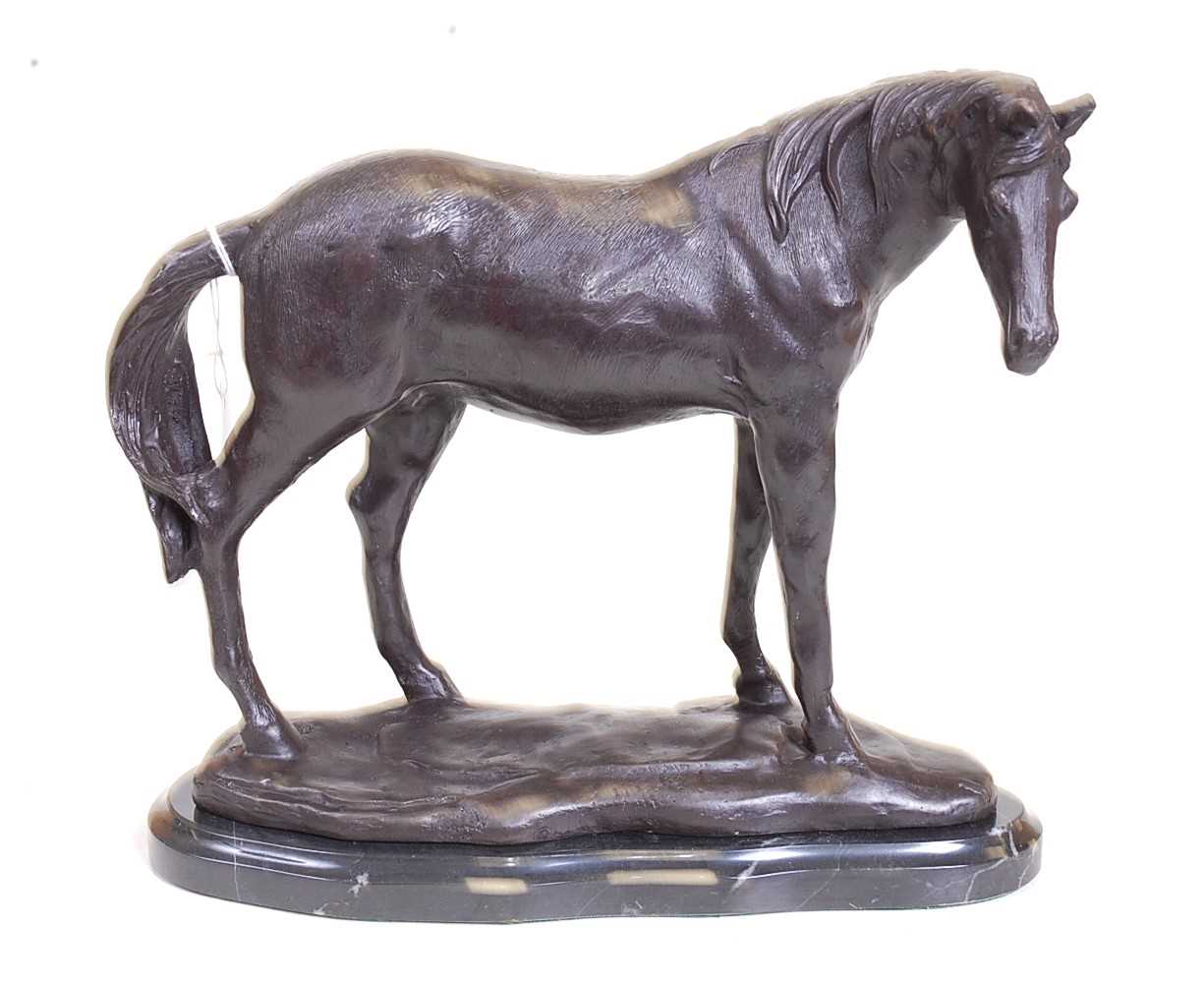 A bronze model of a horse, shown in standing pose, mounted upon a veined black marble plinth, h.23cm