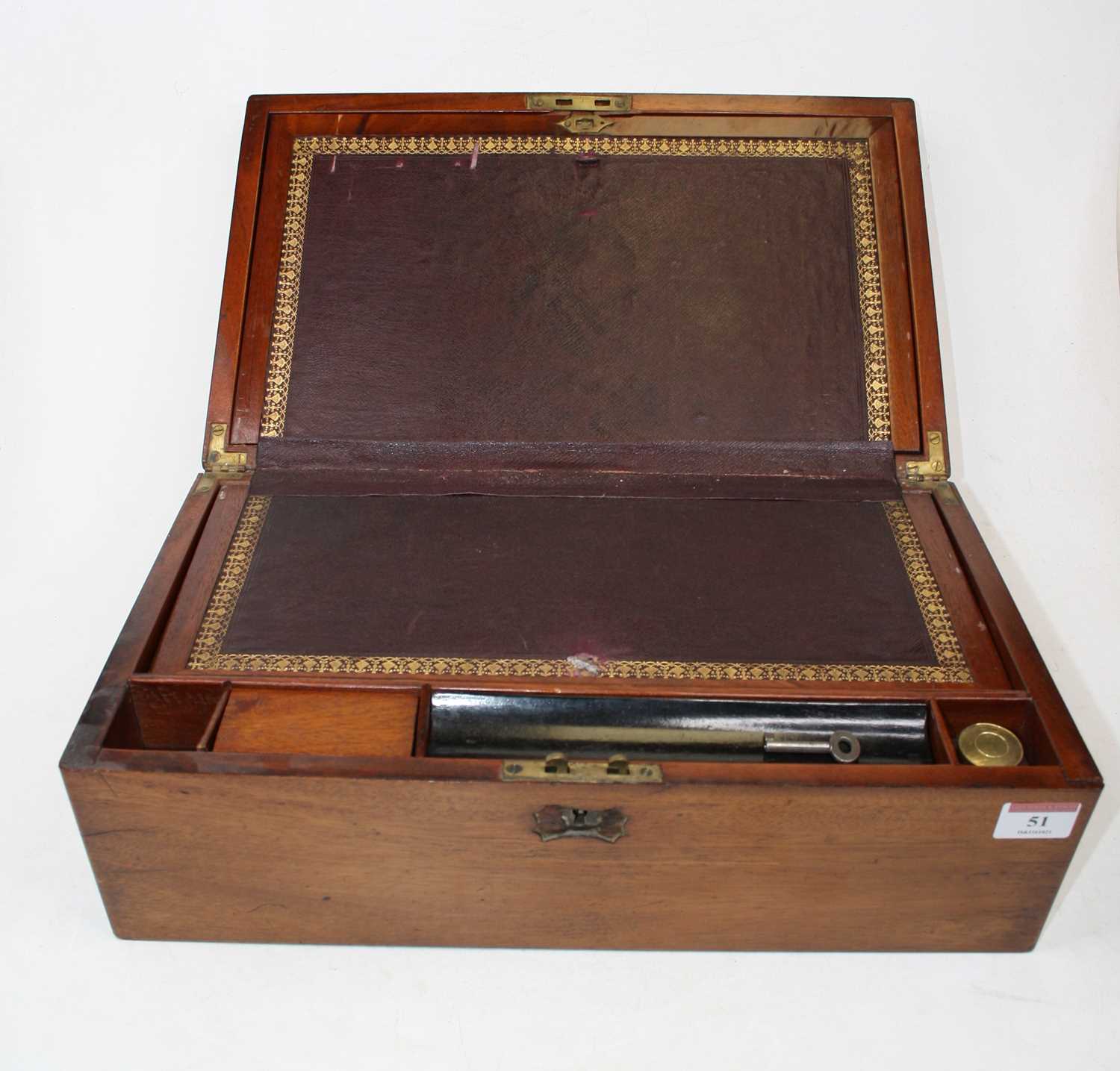 A Victorian mahogany cased writing slope, the lid with brass cartouche opening to reveal a gilt
