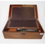 A Victorian mahogany cased writing slope, the lid with brass cartouche opening to reveal a gilt