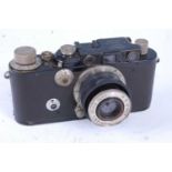 A Leica camera circa 1930, serial No. 98427, having a black body with lacquered brass top plate,