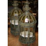 A pair of 20th century verdigris brass effect hanging lanterns, each h.61cm