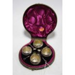 A set of four late Victorian Mappin and Webb silver plated open salts, each of squat circular form