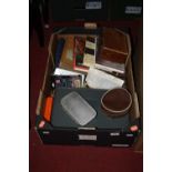 A box containing a collection of fishing related items, to include books, reels, flies etc
