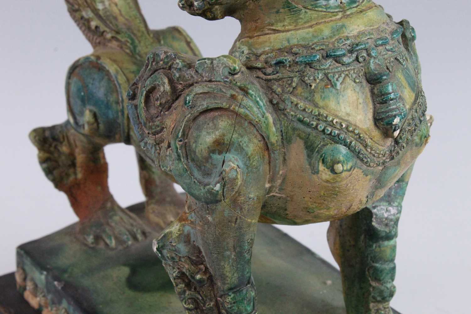 A Chinese green glazed pottery figure of a Fu Lion, modelled in proud standing pose, mounted on a - Image 5 of 12