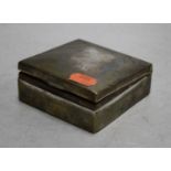 An Edwardian silver clad table cigarette box of square shape, the hinged lid engraved with a dog,