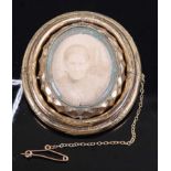 A Victorian pinchbeck mourning brooch, having swivel action with photograph opposing locks of