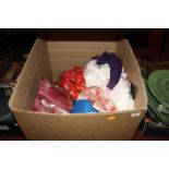 A box containing a collection of children's stuffed toys and Eastern costume