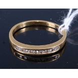 An 18ct gold and diamond half eternity ring as 9 channel set small brilliants, 2.5g, size O