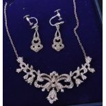 A silver and marcasite set pendant on neck chain, together with a pair of white metal and
