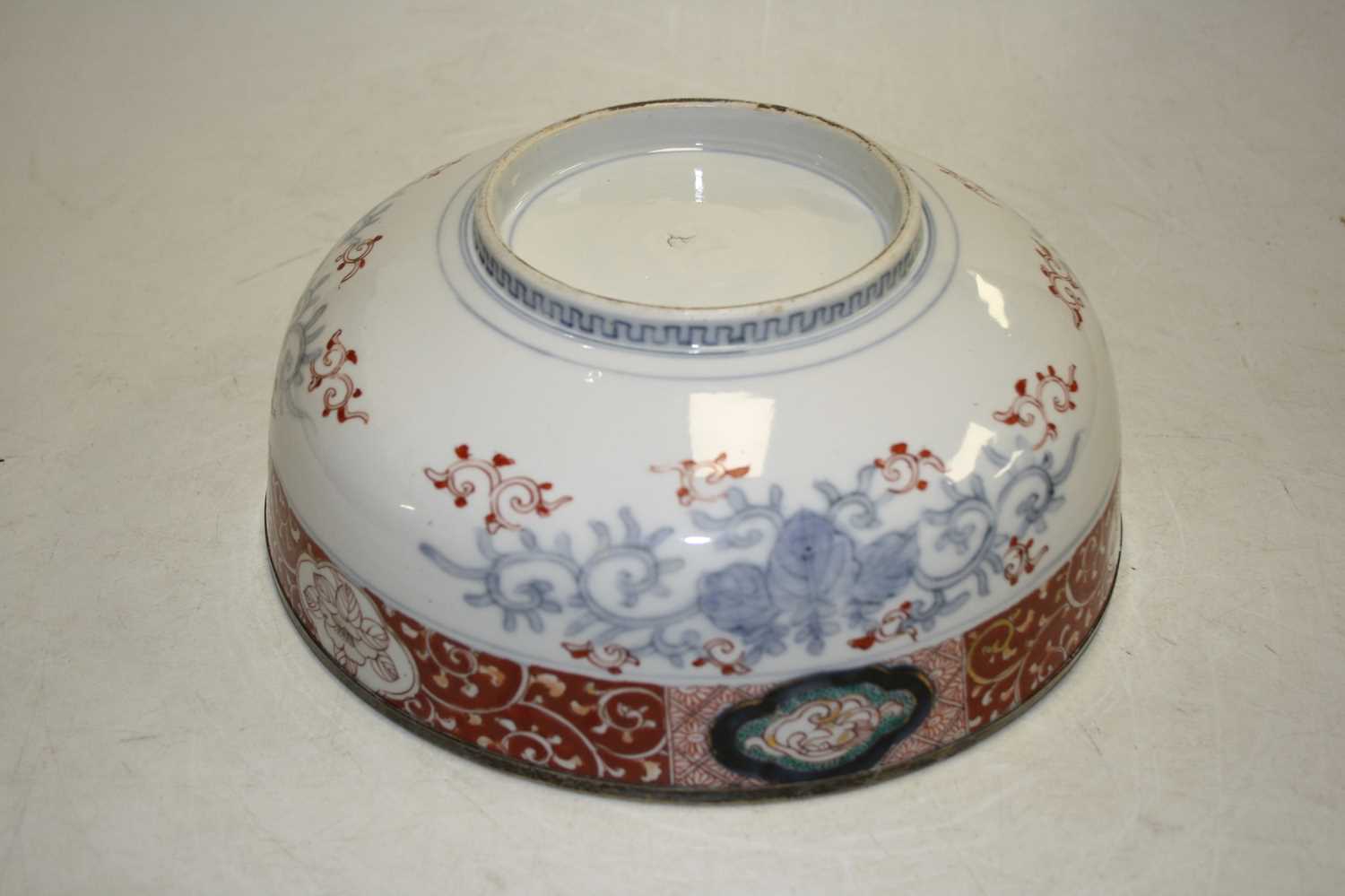 A 19th century bowl, the centre decorated with flowers, in shades of iron red, blue and turquoise, - Image 2 of 5