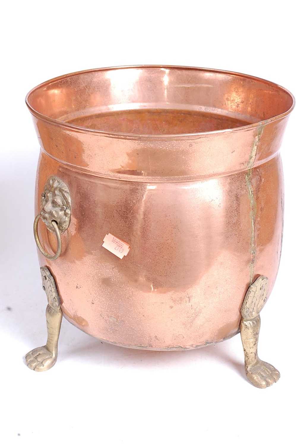 An early 20th century copper and brass jardiniere, flanked by brass lion mask ring handles, standing - Image 3 of 3