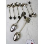 A set of six mid-20th century coffee bean spoons; together with a silver teaspoon with Edinburgh