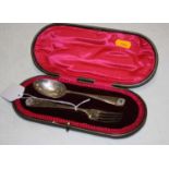 An Edwardian silver christening fork with matching spoon in fitted leather case