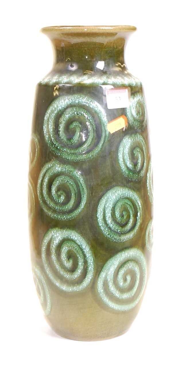 A 1970s German green glazed vase, the flared rim above an ovoid body with spiral decoration, h.40cm