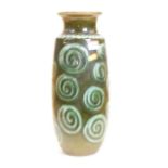 A 1970s German green glazed vase, the flared rim above an ovoid body with spiral decoration, h.40cm