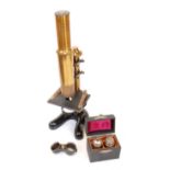 An early 20th century brass monocular microscope, signed E Leitz Wetzlar and numbered 67358, boxed