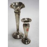 An Edwardian silver trumpet shaped spill vase on a weighted base, together with a George V silver