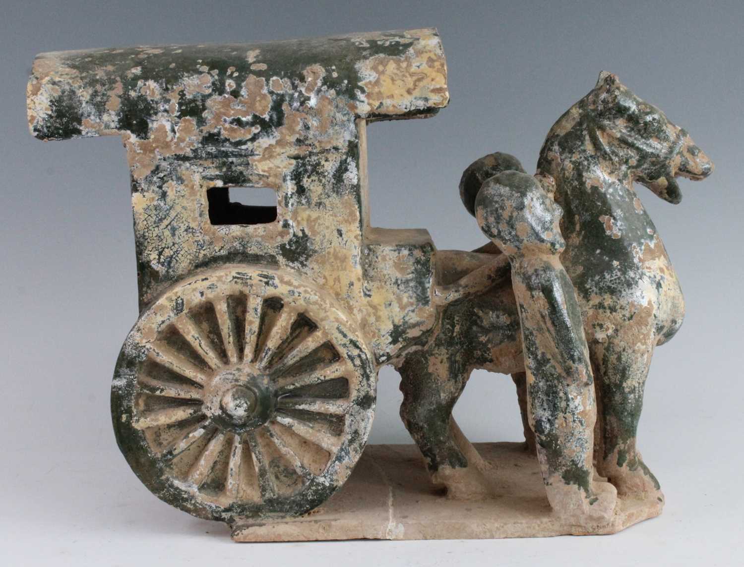 A Chinese green glazed terracotta Mingqi cart, with a single horse flanked by attendants, probably