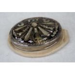 A 19th century white metal, black lacquered, piquet work and mother-of-pearl inlaid pill box of oval