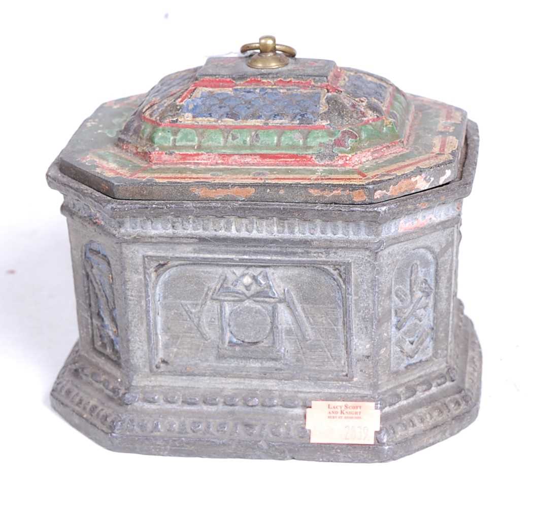 A 19th century pewter tobacco box, the lid with polychromatic decoration, the octagonal body