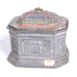 A 19th century pewter tobacco box, the lid with polychromatic decoration, the octagonal body