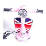 A modern pink painted desk lamp in the form of a Vespa moped, h.33cm