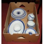 A box containing a Danish blue and white glazed part tea and dinner service