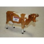 A Beswick figure of a Guernsey cow, model No. 1248A, first version, designed by Arthur