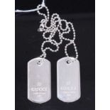A pair of Gucci style white metal dog tags on single chain