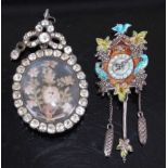 A vintage paste set pendant brooch, inset with silkwork flowers, 5.6cm; together with a white