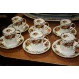 An Elizabethan porcelain English Garden pattern set of 6 cups and saucers