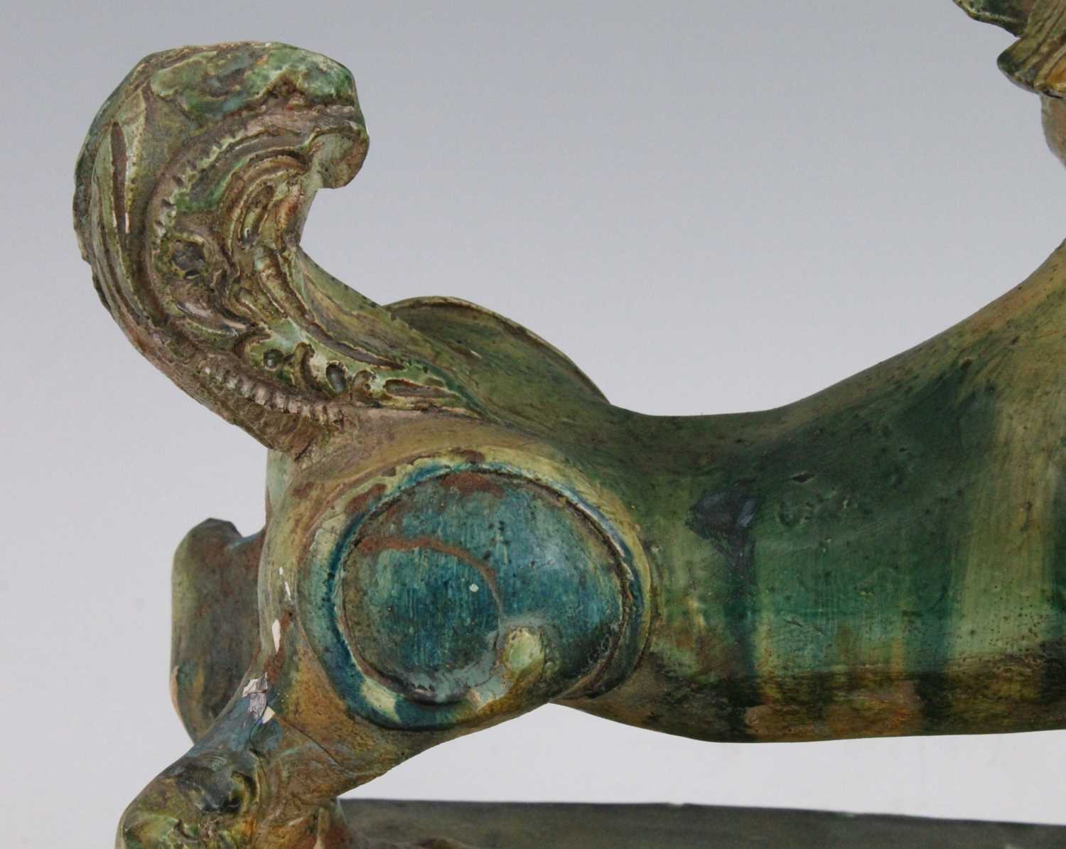 A Chinese green glazed pottery figure of a Fu Lion, modelled in proud standing pose, mounted on a - Image 9 of 12