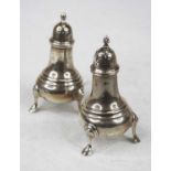 A pair of George V silver pedestal pepperettes