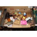 A box containing a collection of dolls house furniture, to include roll-top bath, dressing table,