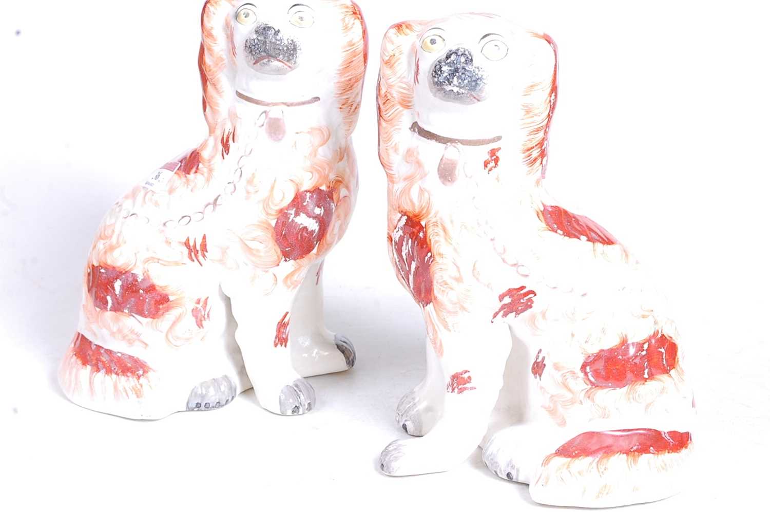 A pair of Staffordshire pottery models of seated spaniels, each h.24cmCondition report: Restored. - Image 2 of 2