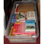 A box containing a collection of books and model kits