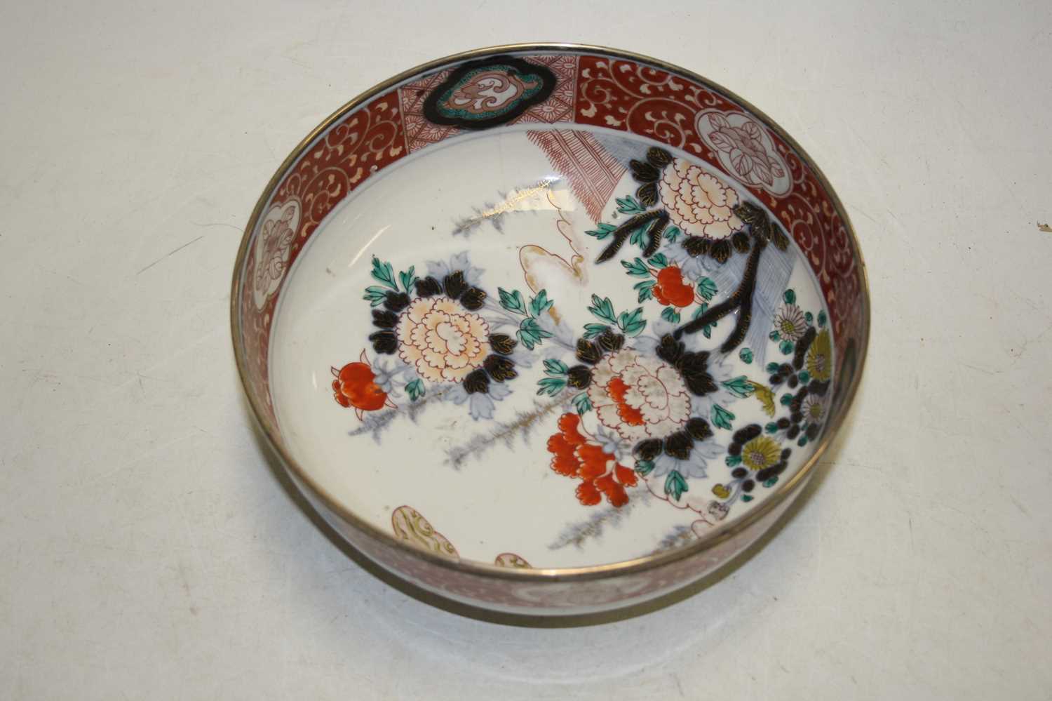 A 19th century bowl, the centre decorated with flowers, in shades of iron red, blue and turquoise, - Image 4 of 5