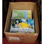 A box containing a collection of approximately 180 Tottenham Hotspur football programmes, mainly