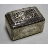 An early 20th century white metal casket of canted rectangular form, the hinged cover with pierced