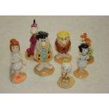 A collection of John Beswick Flintstone figures, to include Fred Flintstone, Wilma Flintstone,