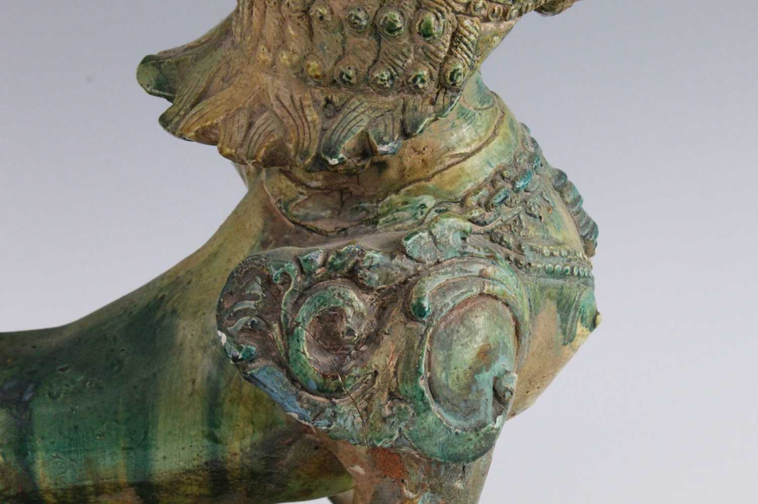 A Chinese green glazed pottery figure of a Fu Lion, modelled in proud standing pose, mounted on a - Image 8 of 12