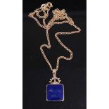 A 9ct gold black onyx and lapis lazuli set pendant on 9ct gold fine link watch chain, 6.9g