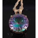 A modern 9ct gold and fluorite(?) set pendant, the round cut four-claw set stone having 15mm