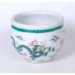 A Chinese export famille verte jardiniere, enamel decorated with a four-clawed dragon below a