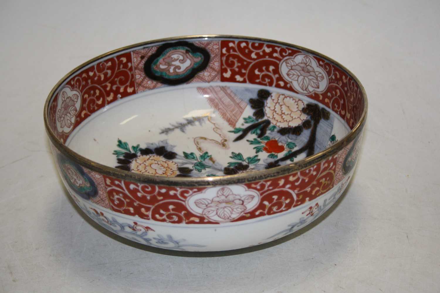 A 19th century bowl, the centre decorated with flowers, in shades of iron red, blue and turquoise, - Image 3 of 5
