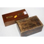 An early 20th century leather clad table cigarette box, of rectangular form, with studded detail;