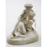 A Victorian parian figure of a woman kneeling beside a river, heightened with gilt decoration, h.