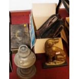 A 19th century style brass door stop in the form of a seated dog, together with an oil lamp, pair of