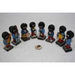 A set of eight painted resin Robertsons musicians figures